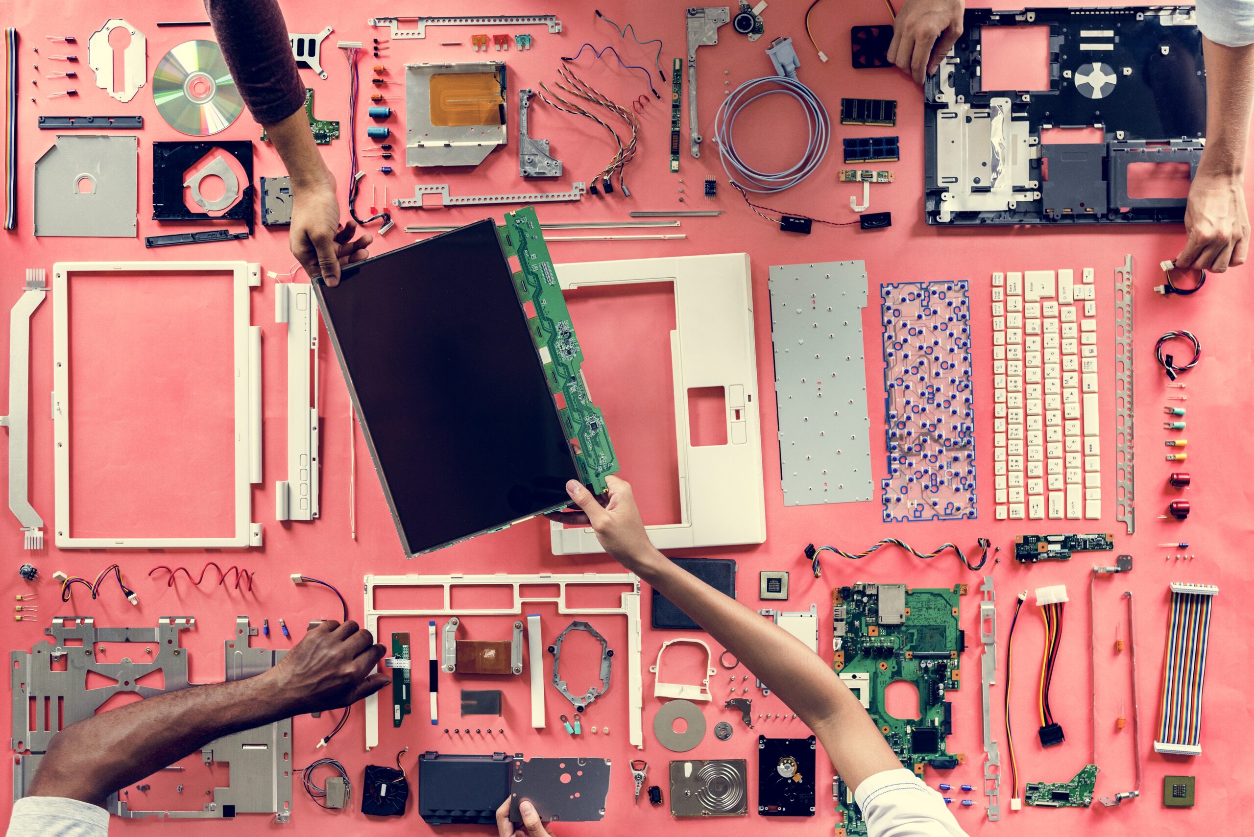 Hands holding a computer component part